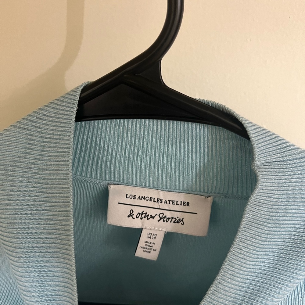 Blue  cut out knit top